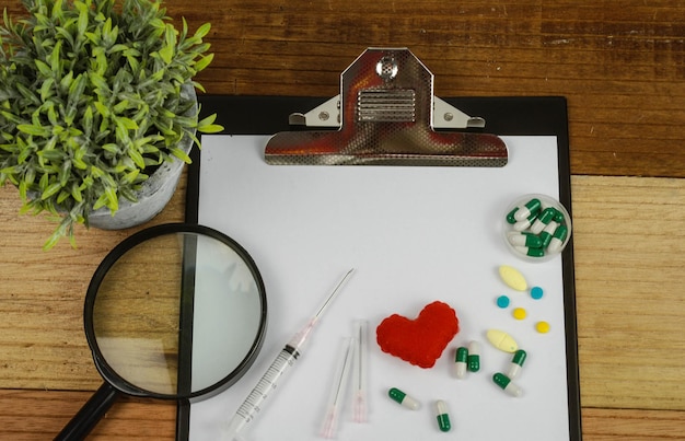 A close-up of medical documents and a stethoscope on a table, symbolizing the importance of medical evidence in a disability claim.