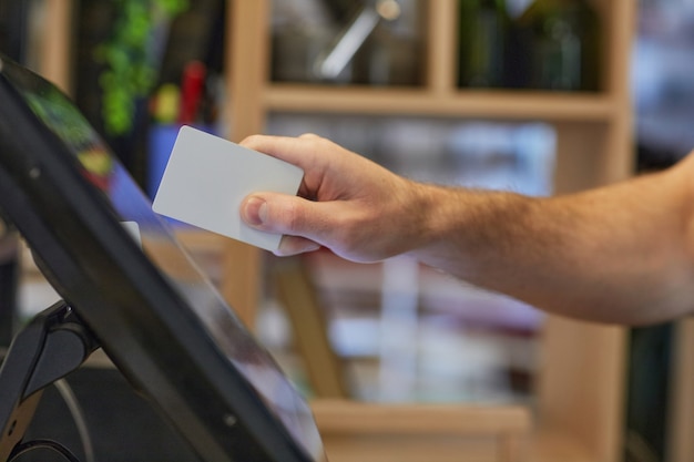 A close-up of an EBT card being swiped at a grocery store checkout. The focus is on the card and the point-of-sale terminal, highlighting the ease of use for SNAP benefits.