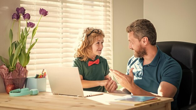 A parent sitting at a desk, carefully reviewing financial documents with a calculator and a concerned expression. The image highlights the challenges of managing finances while seeking SSI benefits for a child with disabilities.