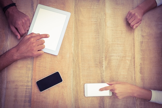 A close-up of hands exchanging information slips or vouchers, symbolizing the transfer of resources to individuals in need. The focus is on the act of providing and receiving help.