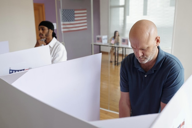 A close-up image of a worried federal employee looking at a notice of furlough, emphasizing the personal impact of a government shutdown on individuals and their families.