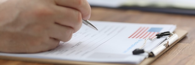 A close-up shot of a government document detailing unemployment benefit eligibility requirements, with sections highlighted.