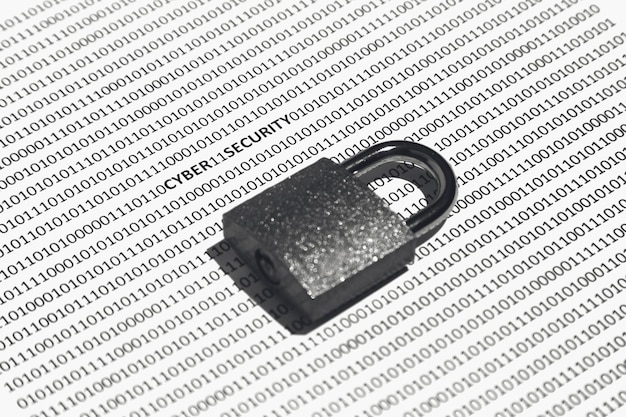 A close-up shot of a padlock securing lines of code, symbolizing data security and digital protection.