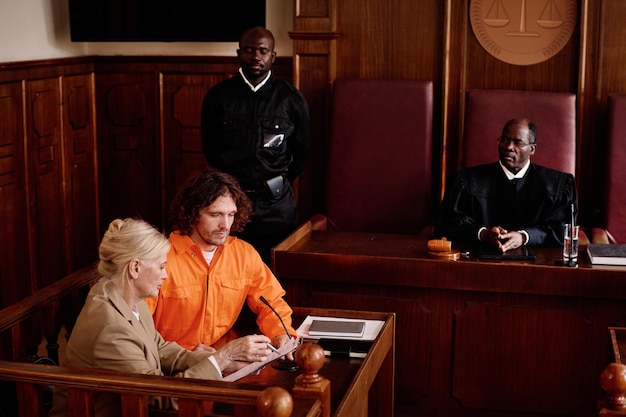 An Administrative Law Judge (ALJ) in a courtroom setting, listening attentively to testimony during a Social Security disability hearing. The image should portray fairness and due process.