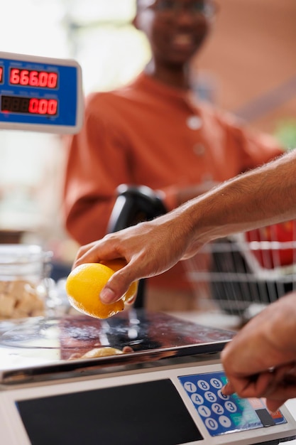 A close-up of an EBT (Electronic Benefit Transfer) card being used at a supermarket checkout. The card is swiped through the card reader, and a receipt is printing out. The background shows various grocery items on the conveyor belt.