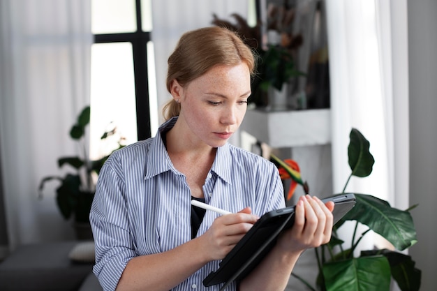 A person confidently holding a calculator while reviewing financial documents, signifying careful financial planning and foresight.