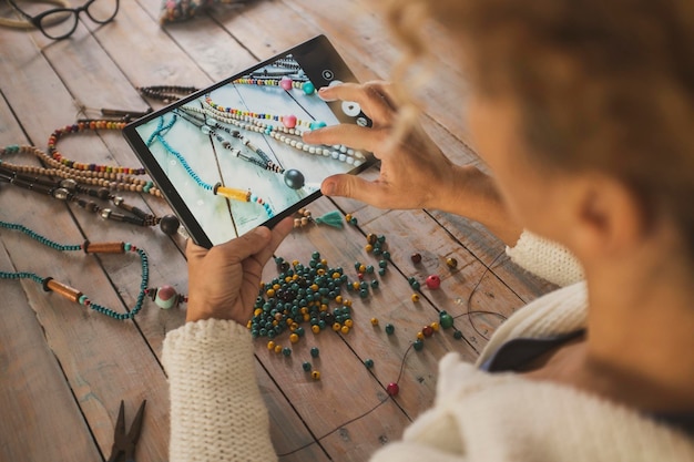 A collage showing different monetization methods: (1) a person selling handmade jewelry at a craft fair, (2) a laptop displaying an online course platform, (3) a smartphone showcasing a blog with ads, (4) a tablet displaying a digital art piece available for purchase.